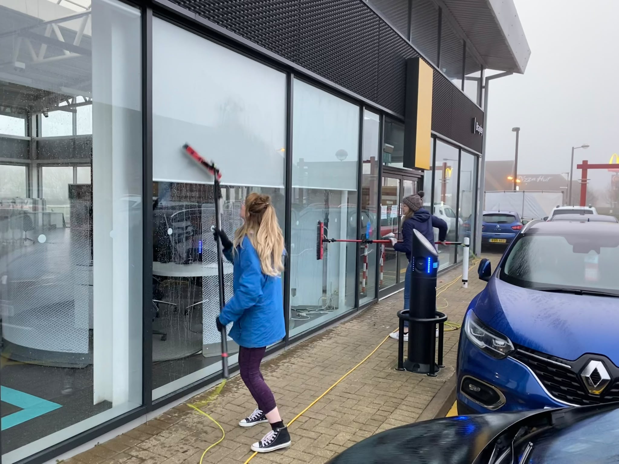 Retail shop window cleaning using water-fed poles